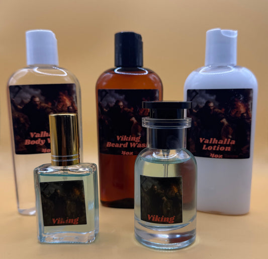 Four bottles of perfume on a beige surface