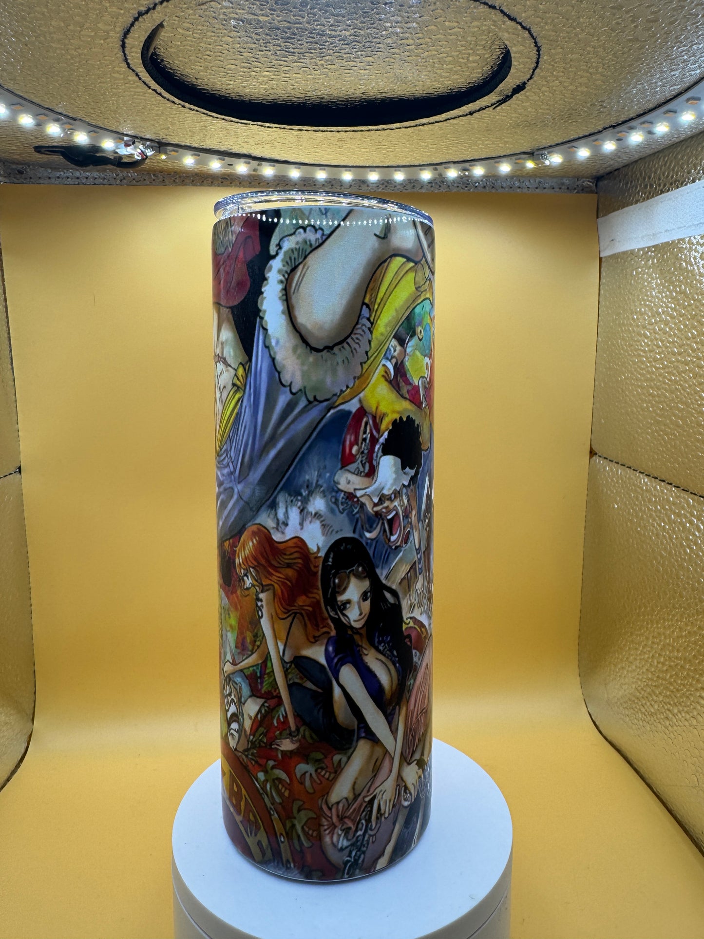 Decorative skateboard with artistic design on a yellow surface